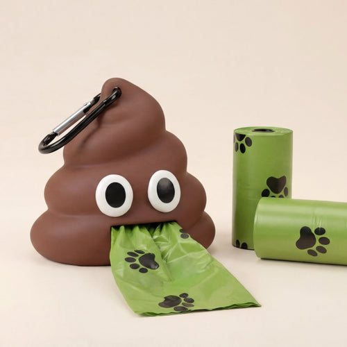 Dog waste bag dispenser shaped like a poopy emoji with two green bags on a beige background